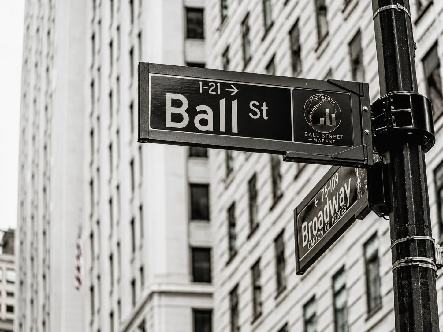 A Ball St street sign on a New York corner, beside a Broadway sign